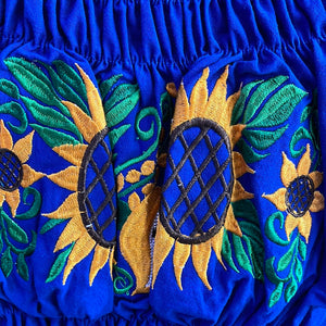 Blusa de girasol de hombro